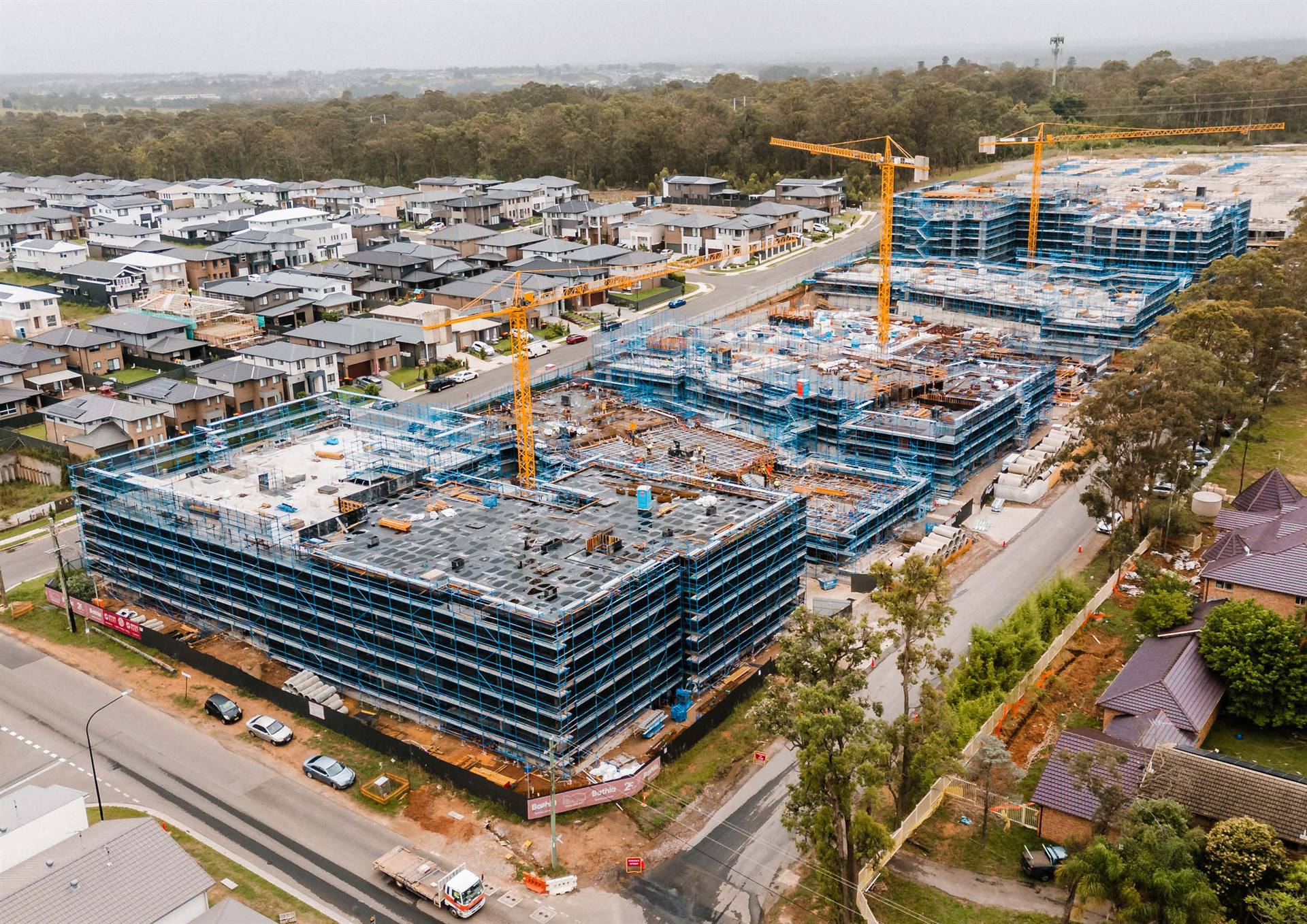 Sydney construction site — formwork decks, scaffold and tower cranes on a Metric temporary works project